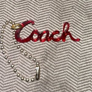 Coach Poppy Acrylic Script Tag with gold chain